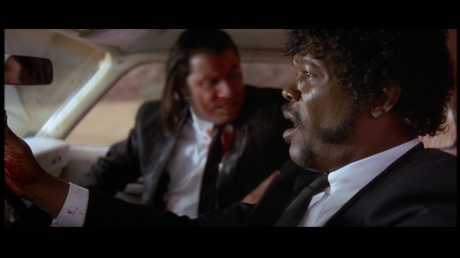 Still from Pulp Fiction of Samuel L Jackson driving the car as John Travolta shoots Marvin in the face