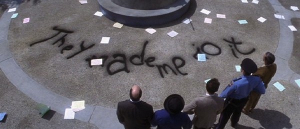 Still from Donnie Darko where someone has written "They made me do it" on the ground